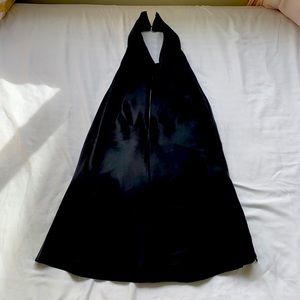 Flores and Flores Black tie around the neck backless silk top. Zips on one side.